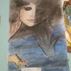 Girl in water with fog around her writing a poem